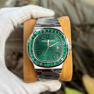 Patek Philippe Nautilus-style watch with a grey dial and a green stone bezel and bracelet accents Euro Grade
