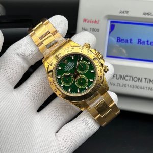 This is a Rolex Cosmograph Daytona reference 116508 watch in gold with a green dial. Swiss 1:1